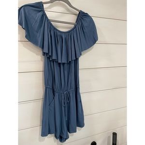 Beautiful blue romper with pockets by Elan. Worn once